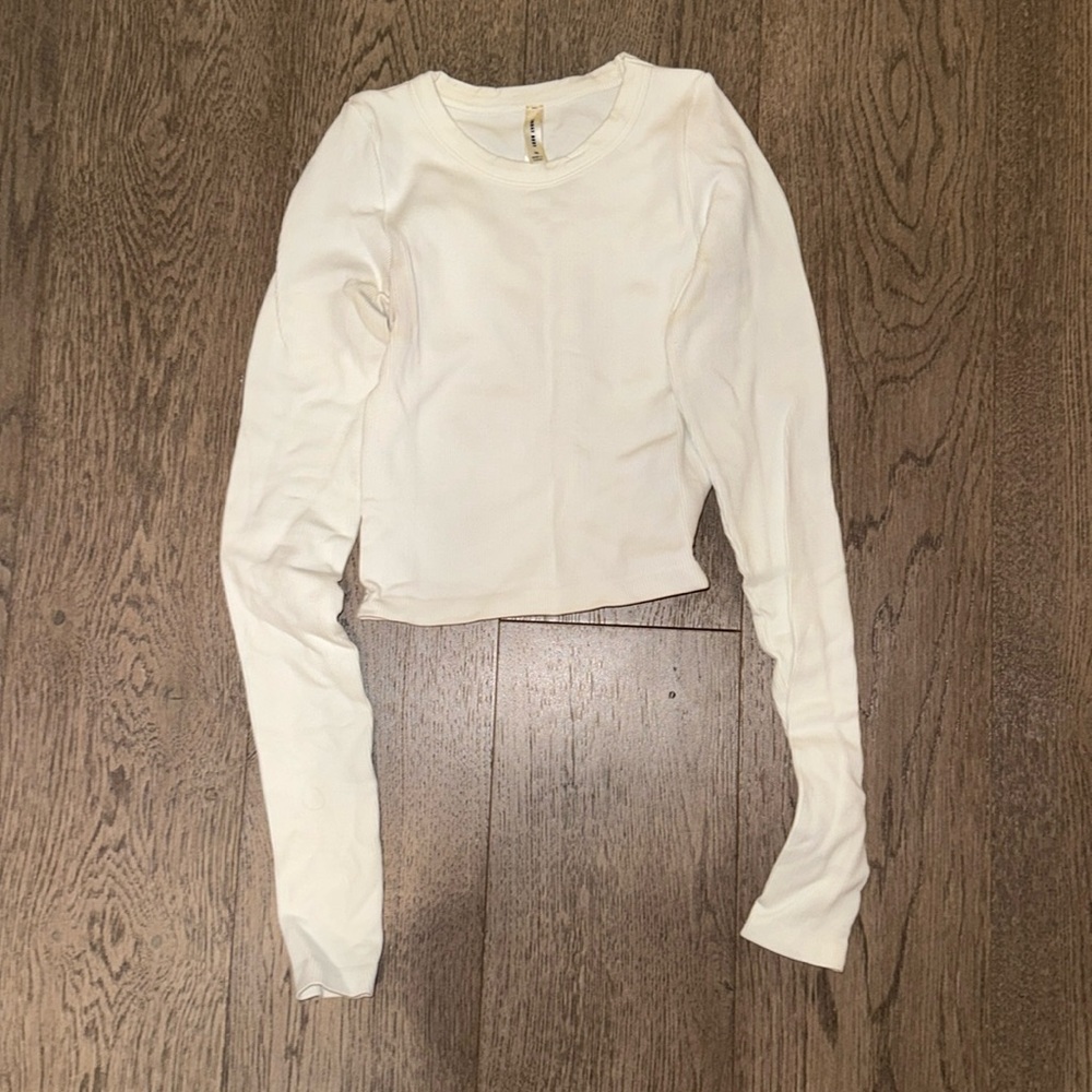 Aritzia- cropped ribbed white long sleeve top.